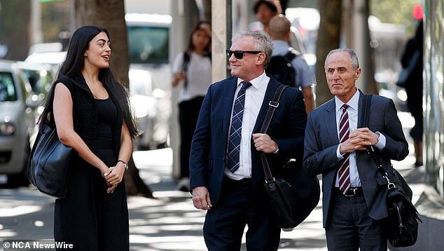 The former Fox Sports TV star (pictured, centre, outside court on Tuesday) told the court that a police officer advised him shortly after his arrest to refuse to be interviewed by other officers.
