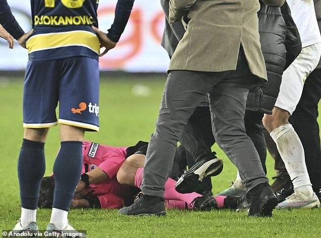 Meler tried to protect his face after the blow as other people kicked him to the ground
