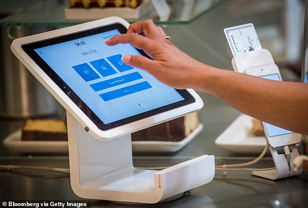 iPad and tablet checkout screens boomed during the pandemic as retailers stopped accepting cash over fears bills could spread Covid-19 germs