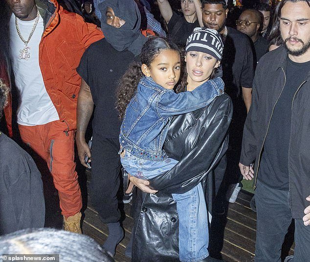 Bianca's friends were reportedly relieved to see her covered up and not wearing a stuffed animal at Kanye's listening party in Miami this week - pictured with Kanye's daughter Chicago