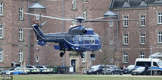 A federal police helicopter lands with the terror suspects on Friday for their arraignment at the Federal Supreme Court (BGH) in Karlsruhe, Germany