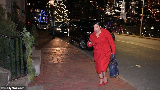 Senator Liz Miranda, wearing a smart red outfit, arrives at the Electeds of Color party at a taxpayer-funded facility in Boston on Wednesday evening