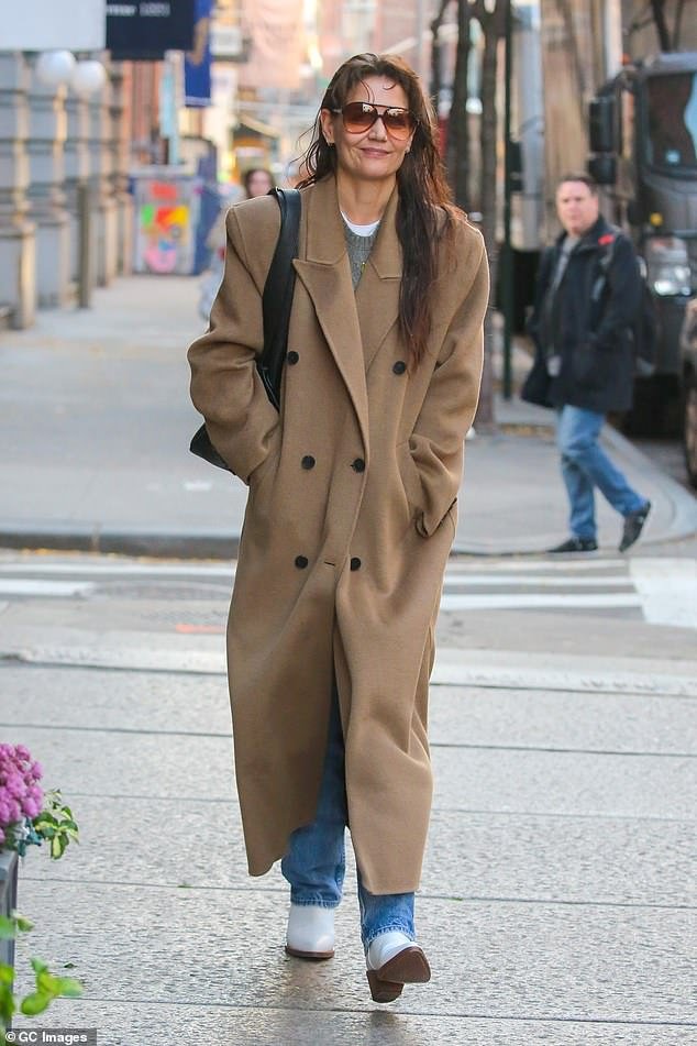 Earlier this month, the filmmaker wore a long, double-breasted camel coat with ombre-hued aviator hats