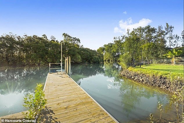 Built in the late 1990s, the renovated property features five bedrooms, three bathrooms and a boat ramp with direct access to the river.