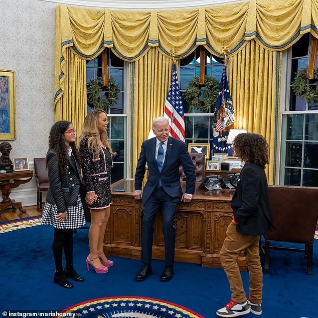 The president speaks with Carey's daughter Monroe and son Moroccan.  The 12-year-old's father is Carey's ex-husband, Nick Cannon