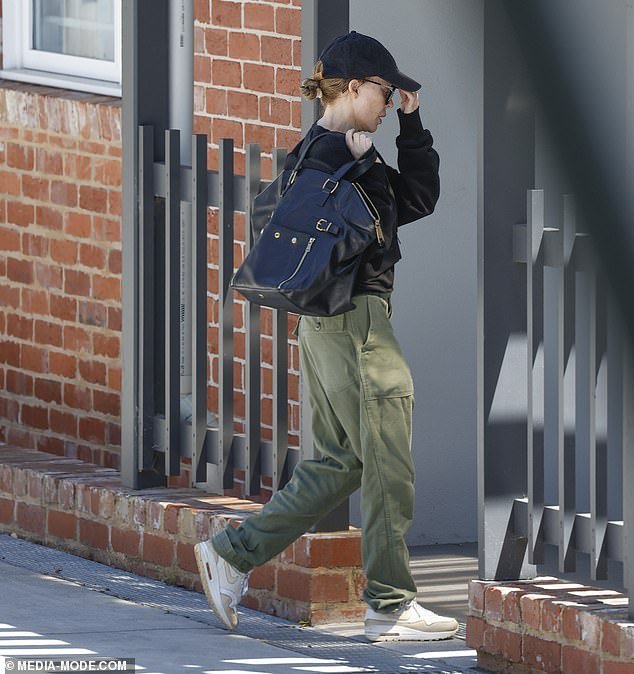 The pop star went incognito with a dark cap and designer sunglasses shielding her famous face