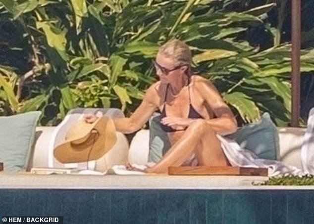 Paltrow was also spotted wearing a bright pink swimsuit a day earlier