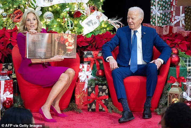 First Lady Jill Biden reads 'Twas The Night Before Christmas' during a holiday visit to patients and families at Children's National Hospital in Washington, DC, on December 22, 2023