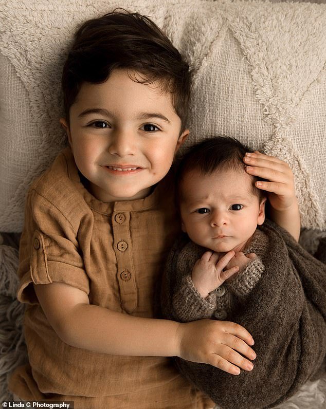 In one of the images, the boys are seen looking at the camera, while Malik smiles as he wraps his arms around his little brother.