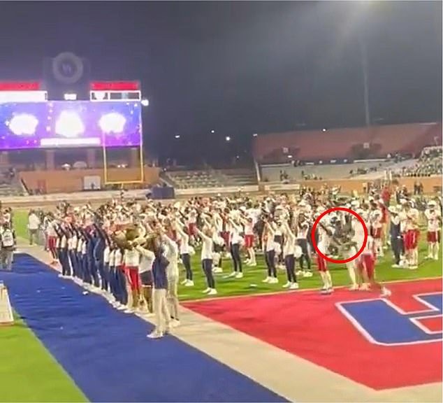 An Eastern Michigan player (circled) appeared to hit a rival in the back of the head