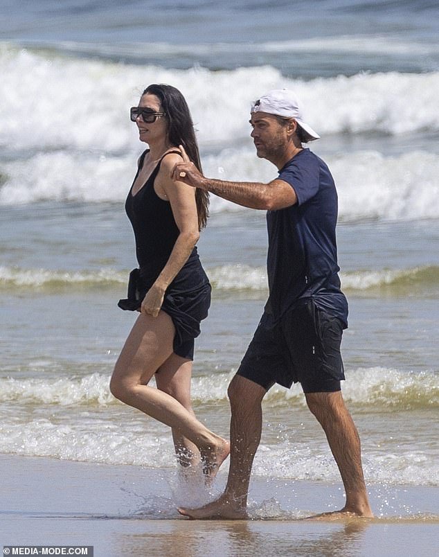 Shannon, 48, the ex-partner of actress Madeleine West, was pictured enjoying a romantic beach date with Erica, 46, and their respective children near his home on the Belongil Beach Peninsula