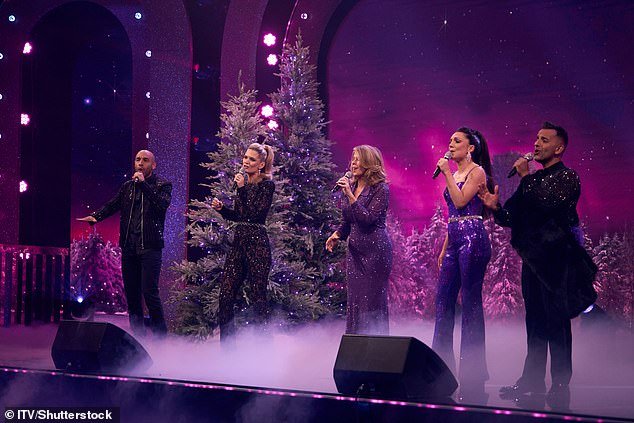 Kate, 56, performed East 17's 1994 number one Christmas hit Stay Another Day with her Good Morning Britain co-stars (L-R: Alex Beresford, Charlotte Hawkins, Kate, Laura Tobin and Dr Amir Khan)