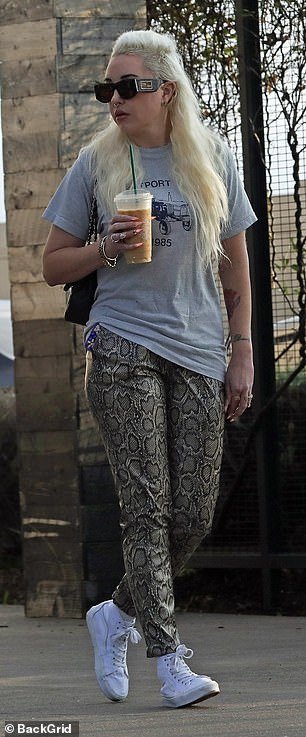 Amanda wore Shein's faux python pants with a baggy gray T-shirt