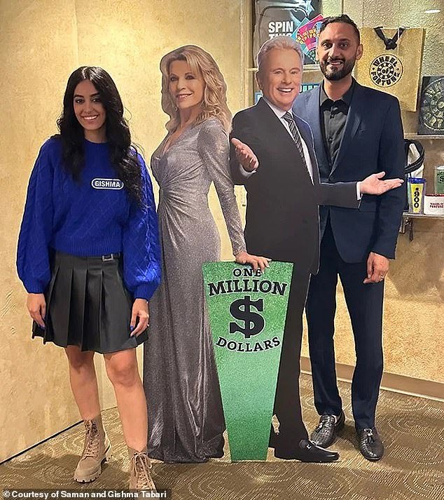 Gishma Tabari and her husband Saman posed with cardboard cutouts of Pat Sajak and Vanna White at the shoot for Wheel of Fortune