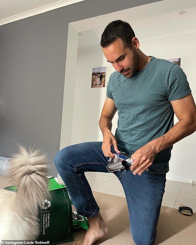 The reality TV star also shared a photo of husband Alexander Vega (pictured) as he opened Christmas presents