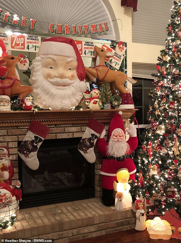 The room in her basement is filled with more than 1,200 Christmas mugs, twinkling lights, Christmas trees and figures of Santa Claus and reindeer