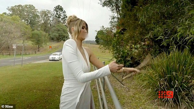 Lauren then rips flowers and branches from a stranger's garden before continuing on her way to her wedding