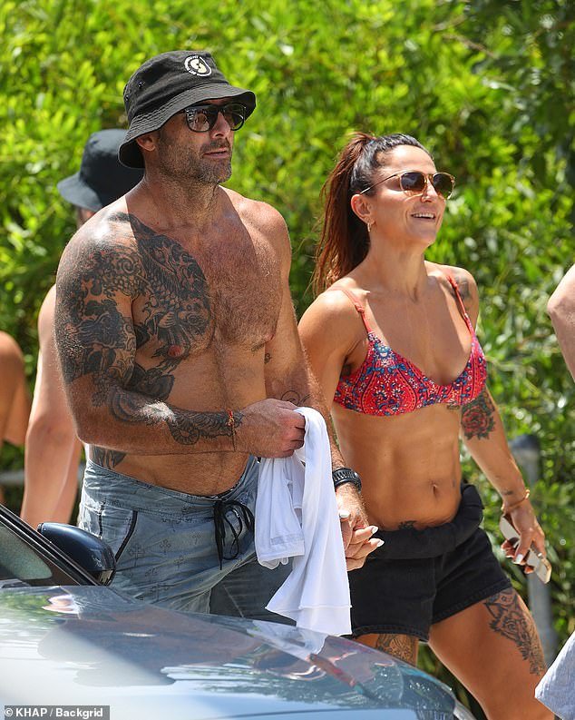 The former The Biggest Loser star was accompanied by his girlfriend Harika Vancuylenberg (right)