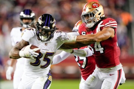 Gus Edwards of the Baltimore Ravens stiff-arms Fred Warner of the San Francisco 49ers during the third quarter of Monday’s game at Levi’s Stadium.
