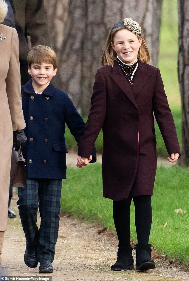 Louis held the hand of his cousin Mia as they walked into the church service at Sandringham