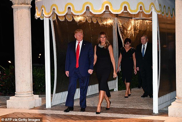 Melania and Donald Trump arrive for Christmas Eve dinner with the former first lady's parents Viktor Knavs and Amalija Knavs in West Palm Beach, Florida on December 24, 2019