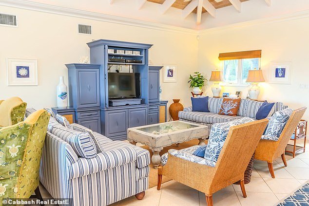 The house has a colorful décor and has a private beach