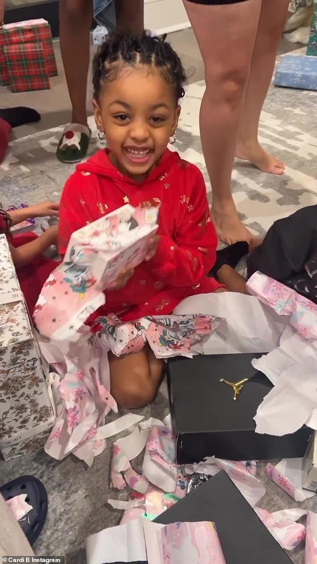 Christmas season: Despite their bitter split, which recently caused the mother-of-two to break down during an emotional Instagram Live, the couple reunited to watch their two children open presents during a family gathering