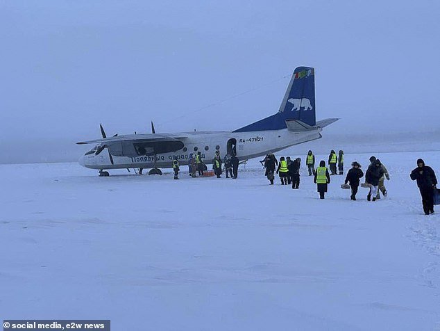 Passengers are escorted off the plane.  According to a report, there were no casualties