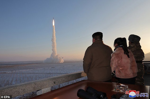 North Korean Supreme Leader Kim Jong Un (3-R) and his daughter Ju-ae (2-R) inspect the launch of a Hwasong-18 ICBM at a secret location in North Korea, December 18, 2023