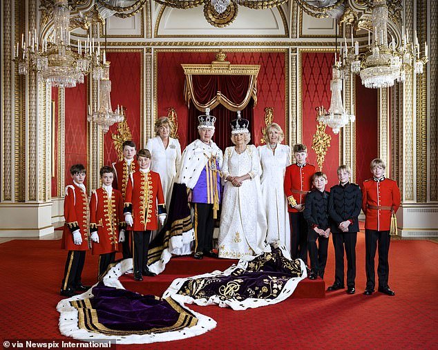 King Charles and Camilla are pictured on the day of their coronation at Buckingham Palace.  The Queen's sister, Annabel, is depicted to the right of Camilla