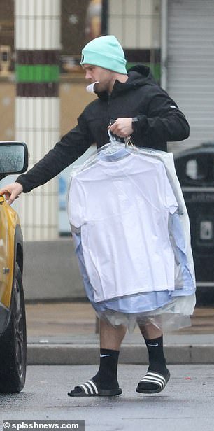 Danny was pictured picking up his clean clothes from a launderette in east London on Friday