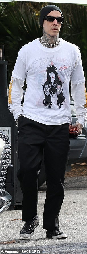 The father of three completed his look with a black beanie that covered his bald and tattooed head and black sunglasses