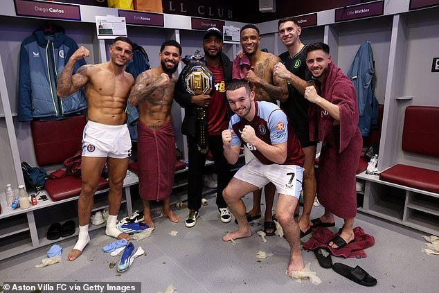 The champions were photographed in the dressing room with Aston Villa players after their victory