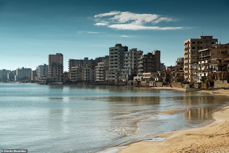 French photographer Dimitri Bourriau explains that Varosha (pictured) 'has been guarded by the Turkish army for more than 50 years' after Turkey invaded in 1974