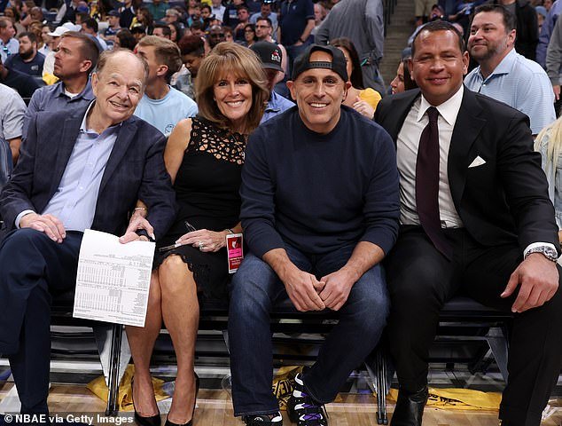 Lore (middle right) and Rodriguez (right) buy the team from Glen Taylor (left)
