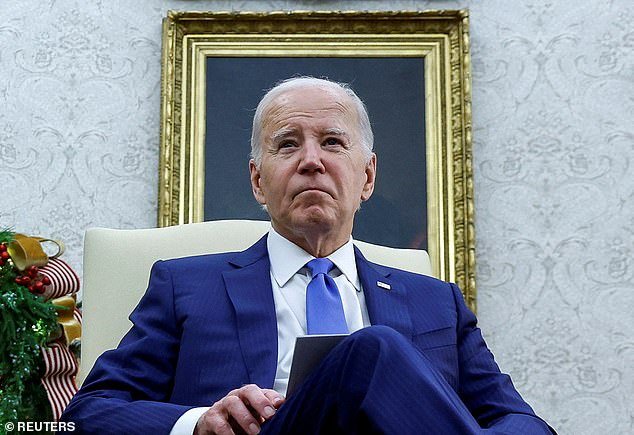 President Joe Biden, pictured in the Oval Office on Thursday, has seen his approval rating among independents drop eight points to a new low of just 27 percent, the November Gallup poll showed