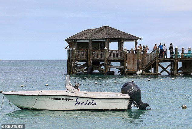 Emergency services converged on a pier at the Sandals resort on Monday following a fatal shark mauling