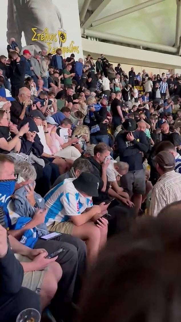 Brighton fans were seen covering their mouths and noses after being exposed to the gas