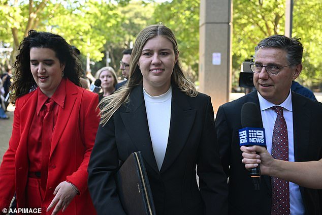 Brittany Higgins (pictured center) leaves after her last day in the witness box at the Federal Court of Australia in Sydney, Tuesday, December 5, 2023