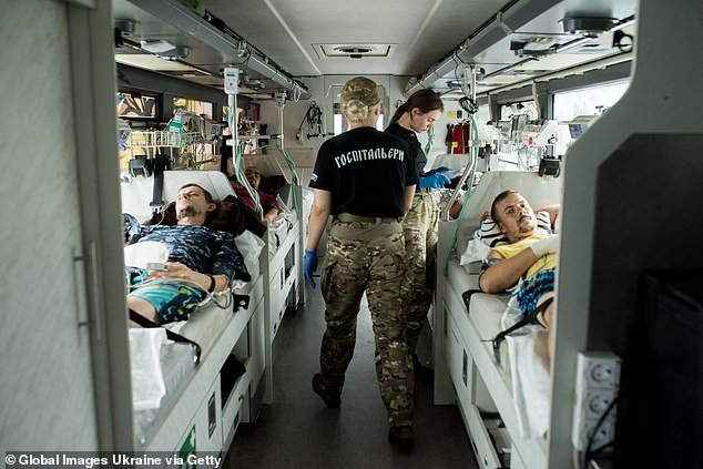 Paramedics check the condition of injured soldiers at the resuscitation bus on August 11, 2023 in Zaporizhia Oblast, Ukraine