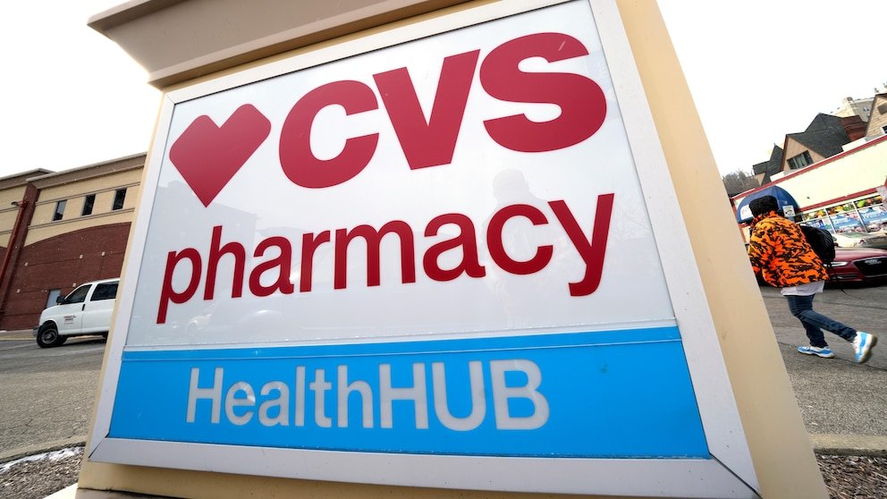 FILE - A CVS store sign is displayed in Pittsburgh on February 3, 2023.  CVS Health is introducing changes to the way its prescription drug pricing model works, which could mean some savings for customers starting next year.  The healthcare giant said Tuesday, Dec. 5, 2023, that it will roll out a new reimbursement model designed to make costs more predictable at the drugstore counter.  (AP Photo/Gene J. Puskar, File)