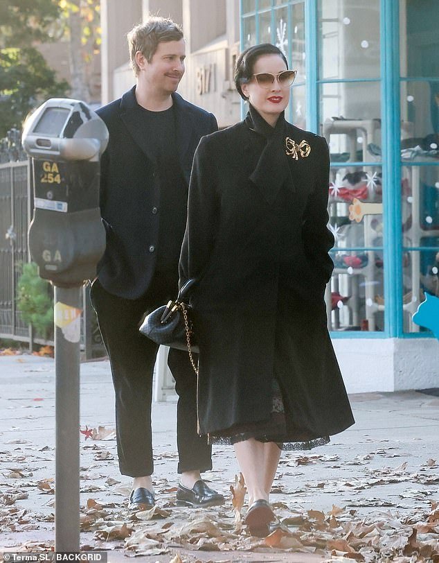 Dita Von Teese was the epitome of old Hollywood glamor as she stepped out in LA with her boyfriend Adam Rajcevich on Sunday