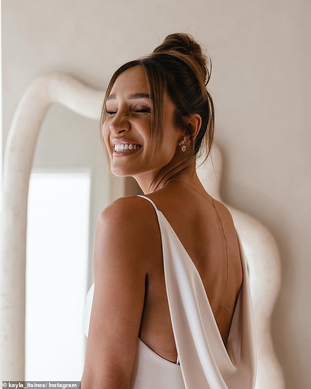 Kayle posted a photo gallery to Instagram on Wednesday showing herself modeling her tight wedding dress and gold jewelry