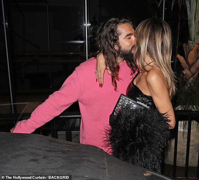 Heidi Klum packed on the PDA with her husband Tom Kaulitz as he picked him up from a glamorous night out on Tuesday