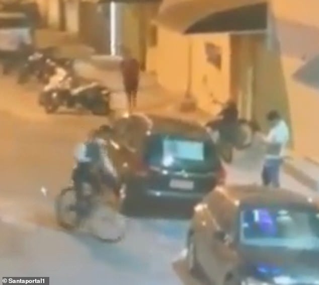 A surveillance camera captured the moment a gunman (left) approached Thiago Rodrigues (right) and shot him dead in the southeastern Brazilian city of Guarujá on Thursday