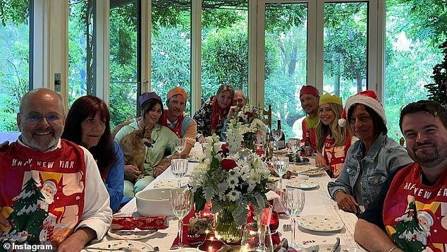 John Farnham looked in good spirits as he celebrated Christmas with his family on Sunday.  The 74-year-old, who is recovering from surgery for oral cancer, hugged his wife Jill as he sat down for a family meal in a photo shared to Instagram.  All depicted