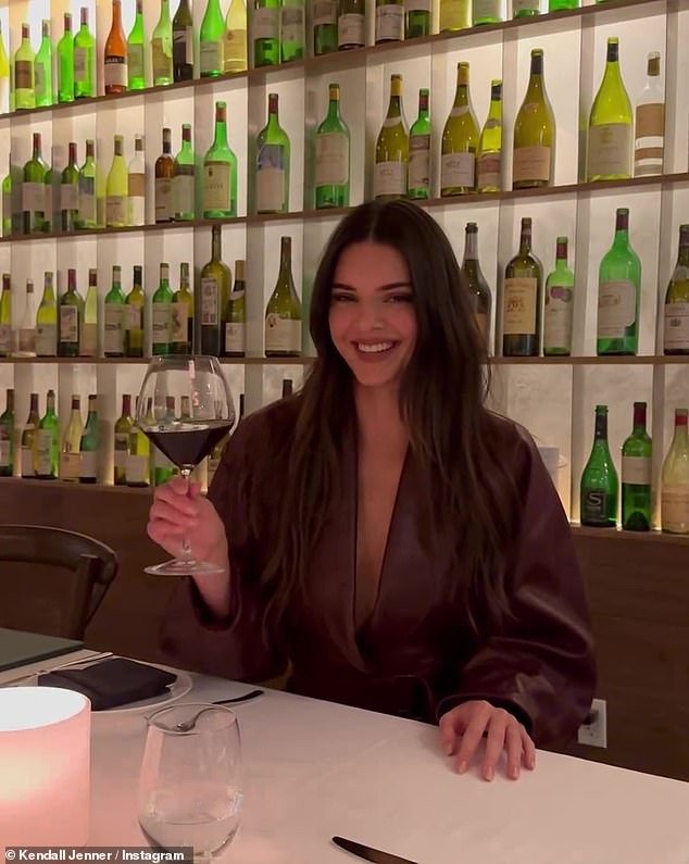 Kendall Jenner loved wine and was feeling great Friday night.  The 28-year-old founder of 818 Tequila posted a series of photos of herself at a restaurant with a glass of red wine for her 294 million Instagram followers