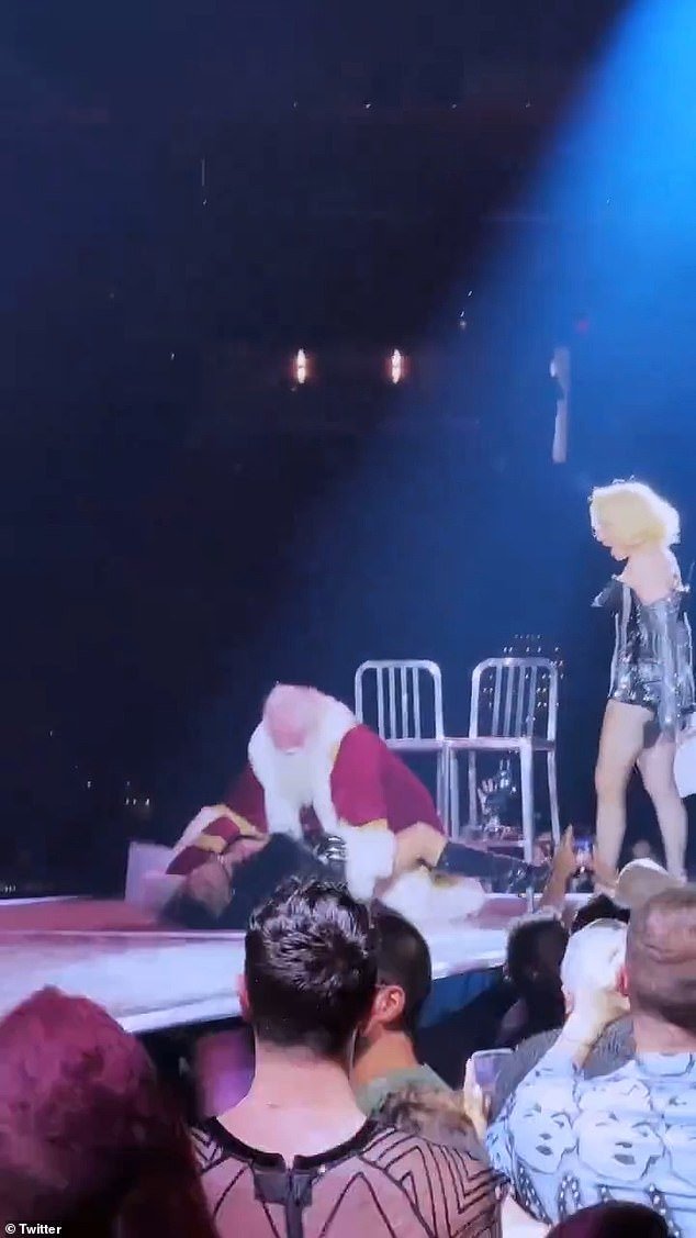 Madonna's backup dancer and a Santa Claus on stage during her Tuesday Celebration tour in Washington DC went down