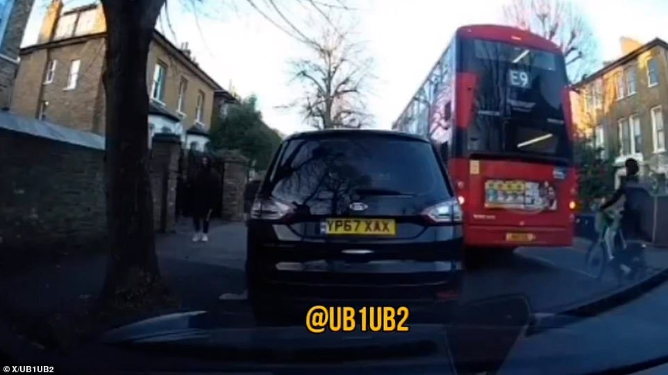 The footage shows the cyclist riding behind the bus as it brakes heavily on Eaton Rise in Ealing, West London