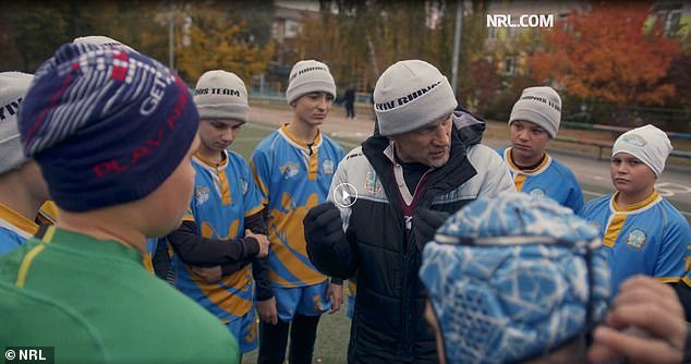 Coach Yevhen Zubritskiy and the players of Kiev Rhinos under 14 during a training session